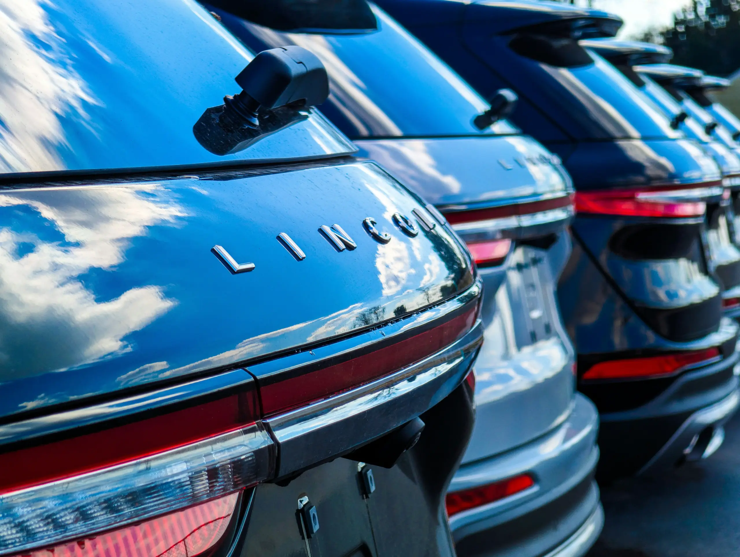 side-by-side comparison of luxury sedan, black SUV, stretch limousine, and sprinter van with simple pricing tags, clean infographic style
